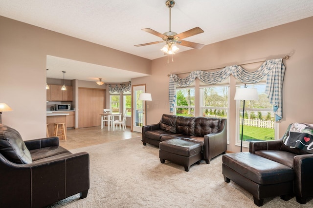 living room featuring ceiling fan