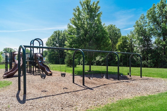community jungle gym with a yard