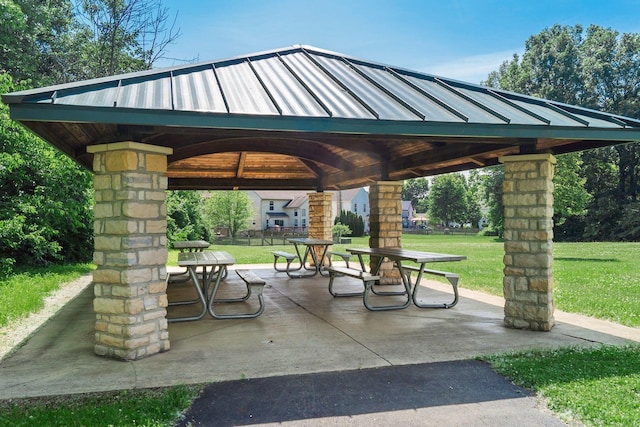 view of property's community with a gazebo and a yard