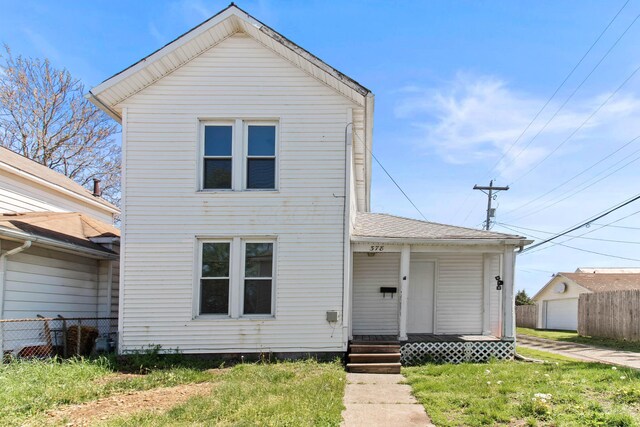 378 Maple Ave, Newark, OH 43055 - view of front of property featuring a front lawn, fence, and covered porch