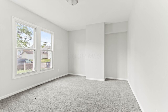 378 Maple Ave, Newark, OH 43055 - carpeted empty room with baseboards