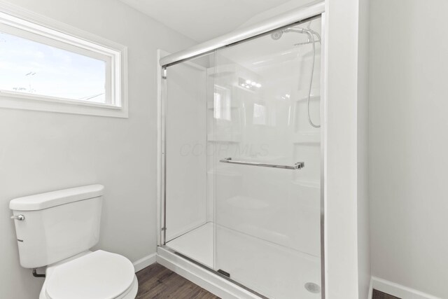 378 Maple Ave, Newark, OH 43055 - bathroom with baseboards, a shower stall, toilet, and wood finished floors