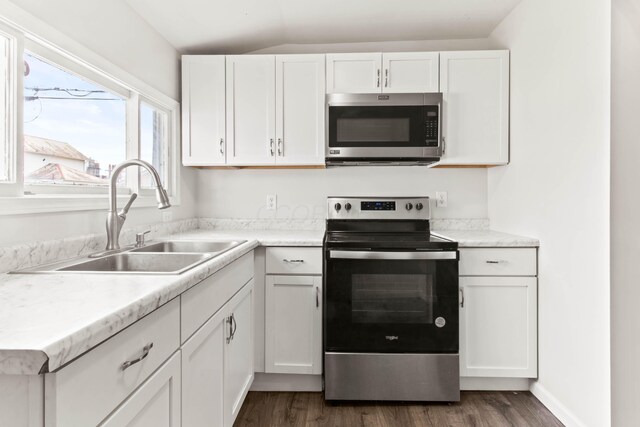 378 Maple Ave, Newark, OH 43055 - kitchen featuring a sink, dark wood finished floors, appliances with stainless steel finishes, and white cabinets