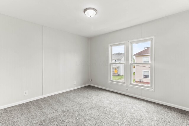 378 Maple Ave, Newark, OH 43055 - empty room featuring baseboards and carpet flooring