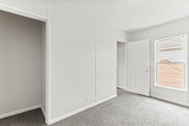 378 Maple Ave, Newark, OH 43055 - unfurnished bedroom with baseboards, carpet, and a closet