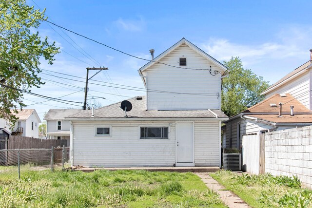378 Maple Ave, Newark, OH 43055 - rear view of property with central AC, fence, and a shingled roof