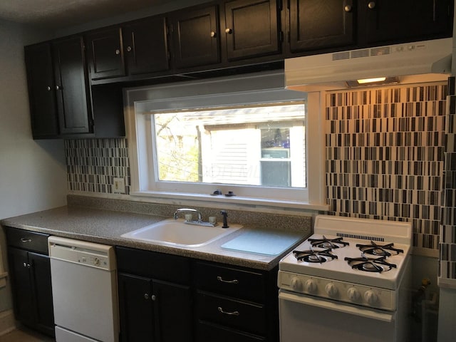 438 E 15th Ave, Columbus, OH 43201 - kitchen with tasteful backsplash, a sink, white appliances, dark cabinets, and under cabinet range hood