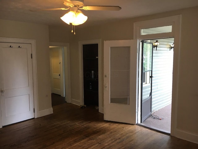 438 E 15th Ave, Columbus, OH 43201 - interior space featuring dark wood-type flooring, baseboards, and a ceiling fan