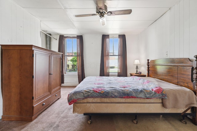 9 S 11th St, Newark, OH 43055 - bedroom with carpet flooring, ceiling fan, and wood walls