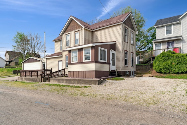 9 S 11th St, Newark, OH 43055 - view of front facade with metal roof, an outbuilding, and entry steps