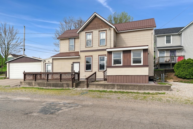 9 S 11th St, Newark, OH 43055 - traditional-style house with metal roof, an outdoor structure, and a garage
