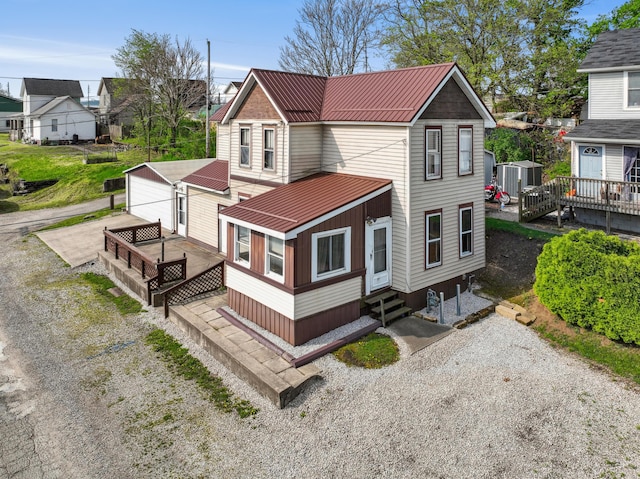 9 S 11th St, Newark, OH 43055 - back of house with a residential view, a shed, entry steps, an outdoor structure, and metal roof