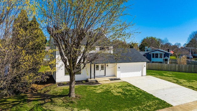 500 Hemlock Pl, Newark, OH 43055 - traditional-style house featuring fence, a front lawn, a residential view, concrete driveway, and a garage