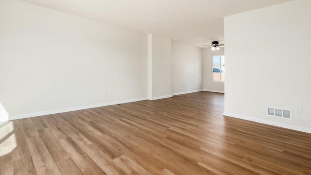 500 Hemlock Pl, Newark, OH 43055 - spare room with wood finished floors, visible vents, a ceiling fan, and baseboards