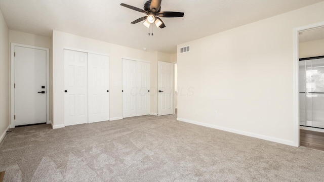 500 Hemlock Pl, Newark, OH 43055 - unfurnished bedroom with ensuite bathroom, two closets, carpet, baseboards, and visible vents