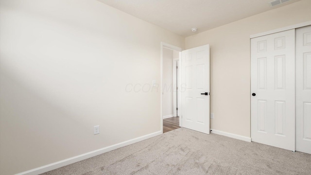 500 Hemlock Pl, Newark, OH 43055 - unfurnished bedroom featuring a closet, carpet flooring, and baseboards