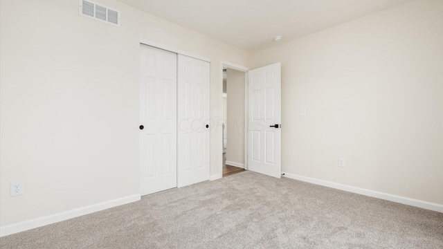 500 Hemlock Pl, Newark, OH 43055 - unfurnished bedroom featuring a closet, carpet, visible vents, and baseboards