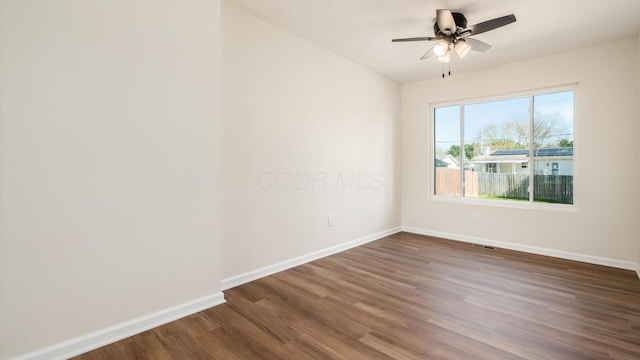 500 Hemlock Pl, Newark, OH 43055 - empty room with baseboards, a ceiling fan, and dark wood-style floors