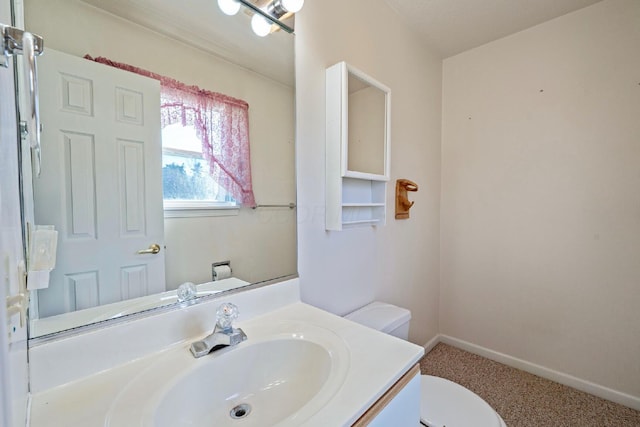 half bathroom with toilet and vanity