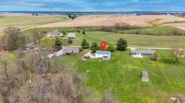 birds eye view of property featuring a rural view