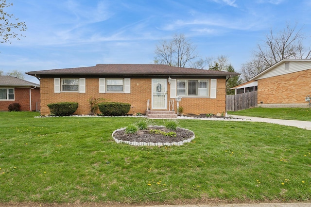 5072 Teddy Dr, Columbus, OH 43227 - view of front of property featuring fence, a front lawn, and brick siding