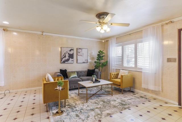 5072 Teddy Dr, Columbus, OH 43227 - living area with ornamental molding, tile walls, a ceiling fan, and tile patterned floors