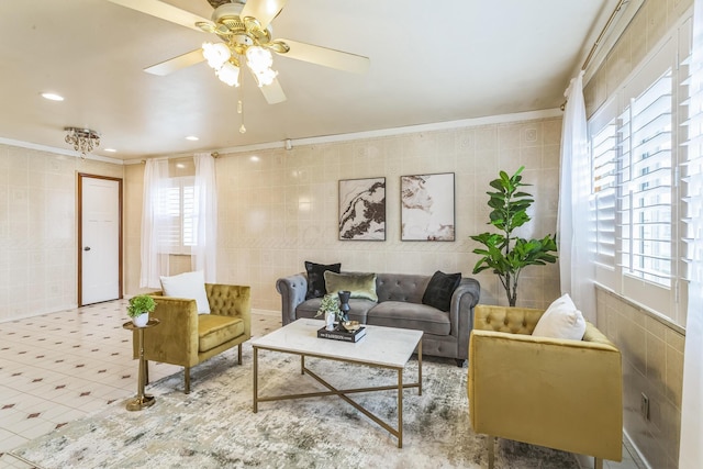 5072 Teddy Dr, Columbus, OH 43227 - tiled living area featuring crown molding, a ceiling fan, and tile walls