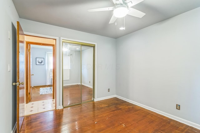 5072 Teddy Dr, Columbus, OH 43227 - unfurnished bedroom featuring a closet, baseboards, ceiling fan, and wood finished floors