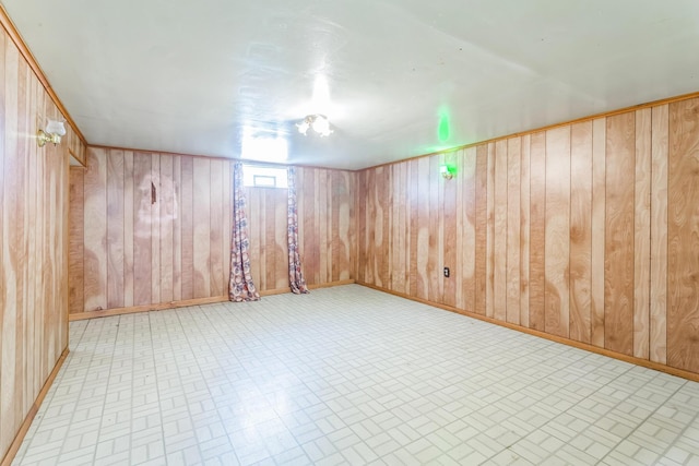 5072 Teddy Dr, Columbus, OH 43227 - below grade area with wooden walls, baseboards, and brick patterned floor