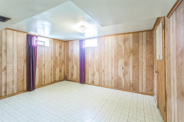 5072 Teddy Dr, Columbus, OH 43227 - empty room with wooden walls and brick patterned floor