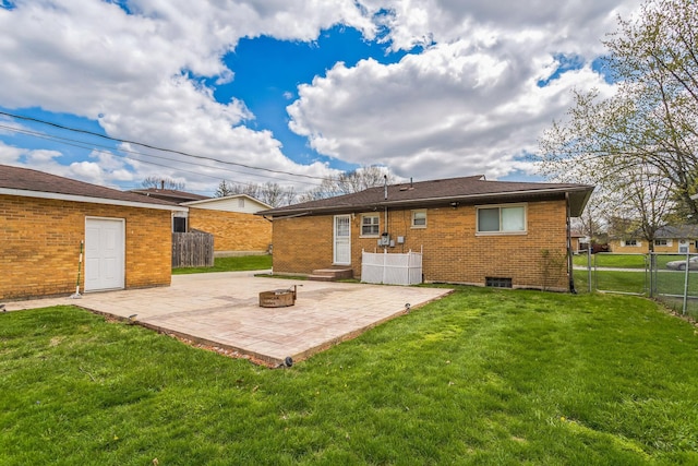 5072 Teddy Dr, Columbus, OH 43227 - rear view of property featuring a patio area, brick siding, an outdoor fire pit, a yard, and fence