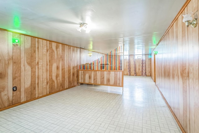 5072 Teddy Dr, Columbus, OH 43227 - additional living space with wooden walls and brick patterned floor