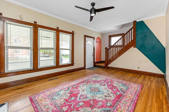 1297 S 4th St, Columbus, OH 43206 - foyer with stairway, wood finished floors, ornamental molding, baseboards, and ceiling fan