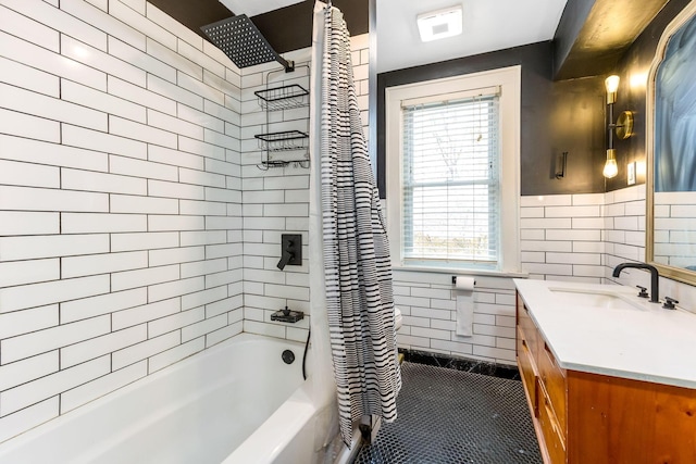 1297 S 4th St, Columbus, OH 43206 - full bath with tile walls, shower / bath combo with shower curtain, vanity, and wainscoting