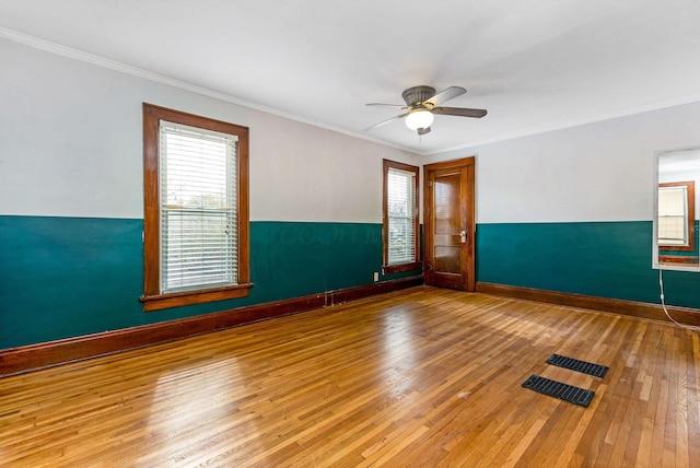 1297 S 4th St, Columbus, OH 43206 - empty room featuring baseboards, a ceiling fan, hardwood / wood-style floors, and plenty of natural light