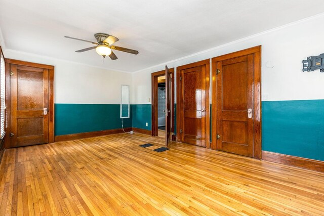 1297 S 4th St, Columbus, OH 43206 - empty room with ceiling fan, baseboards, crown molding, and light wood-style flooring