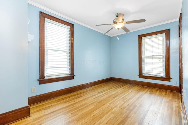 1297 S 4th St, Columbus, OH 43206 - spare room featuring hardwood / wood-style flooring, ceiling fan, baseboards, and crown molding