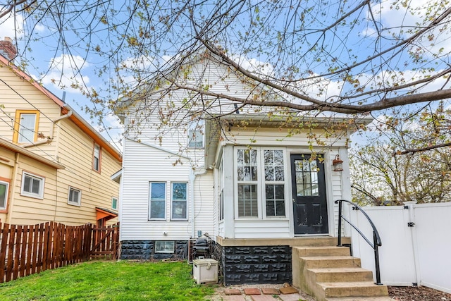 1297 S 4th St, Columbus, OH 43206 - back of property featuring a gate, a fenced backyard, entry steps, and a lawn