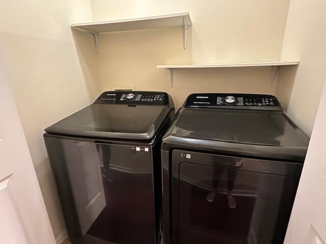 laundry room with washing machine and dryer and laundry area