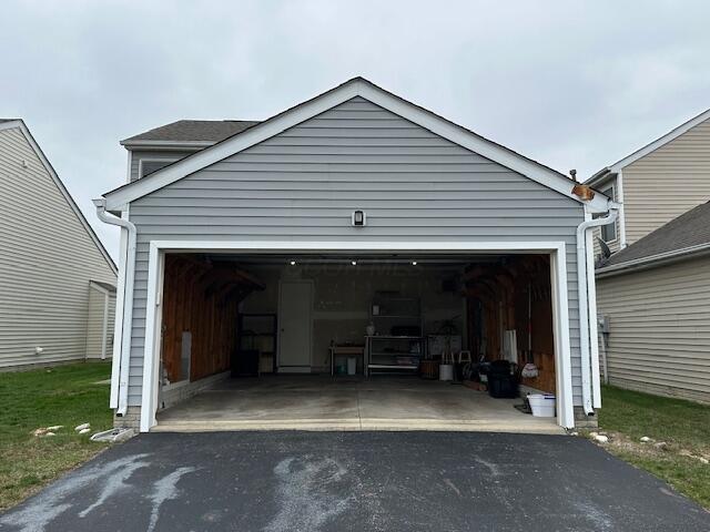 garage featuring aphalt driveway