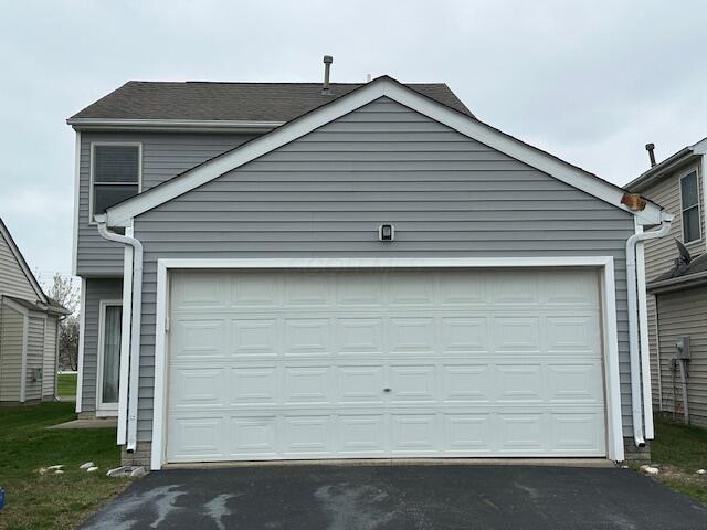 garage with driveway