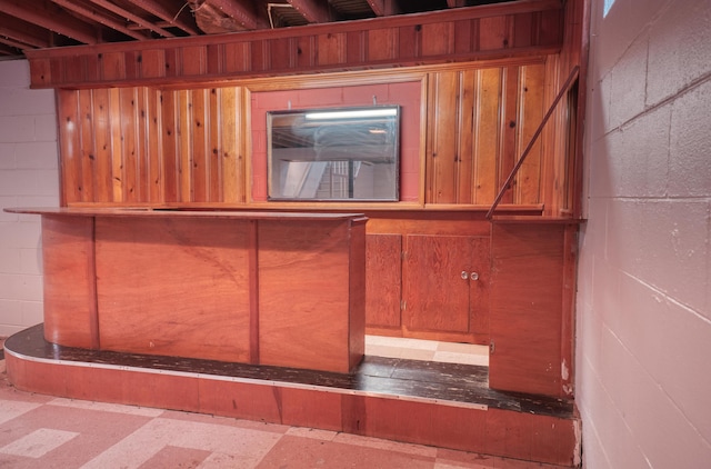 room details featuring tile patterned floors and concrete block wall