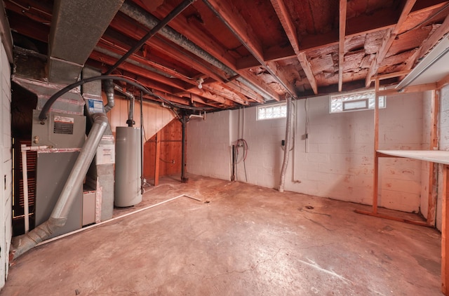 basement with water heater and heating unit