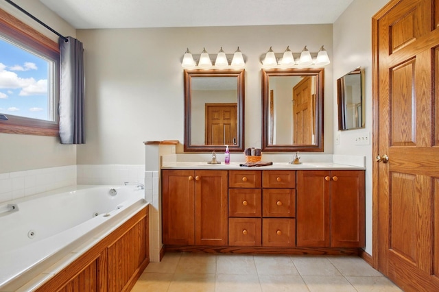 full bath featuring a sink, a whirlpool tub, tile patterned floors, and double vanity