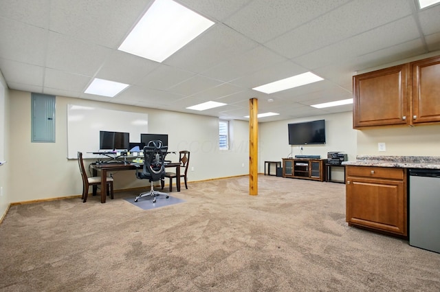 office area featuring a paneled ceiling, baseboards, light carpet, and electric panel