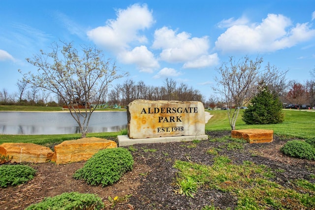 community sign with a water view