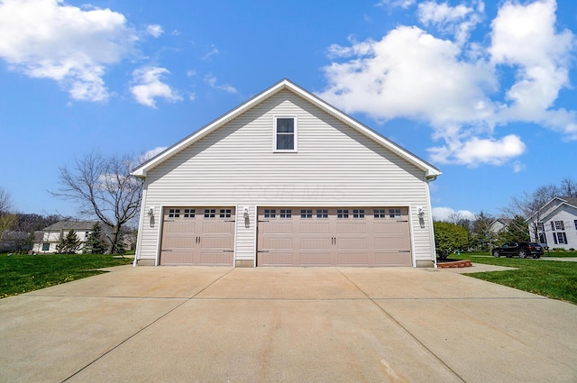 view of home's exterior with concrete driveway, a yard, and a garage