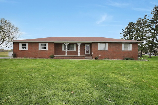 ranch-style house with brick siding, a front lawn, and a porch