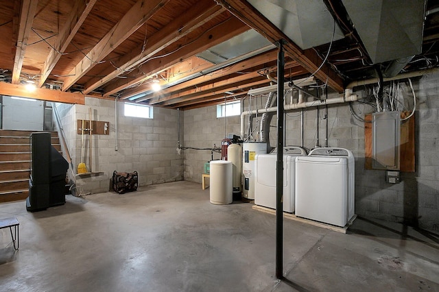 below grade area featuring stairs and washing machine and clothes dryer