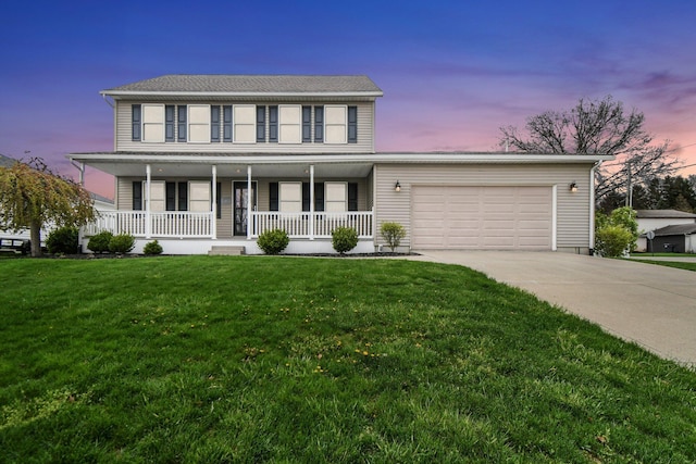 191 Craig Dr, Thornville, OH 43076 - view of front of house featuring a garage, a porch, driveway, and a lawn